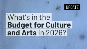 An image with a frosty blue background featuring text that reads ‘What’s in the Budget for Culture and Arts in 2026?’ in bold and varying font sizes. A black rectangular label in the top-right corner displays the word ‘UPDATE’ in white text.